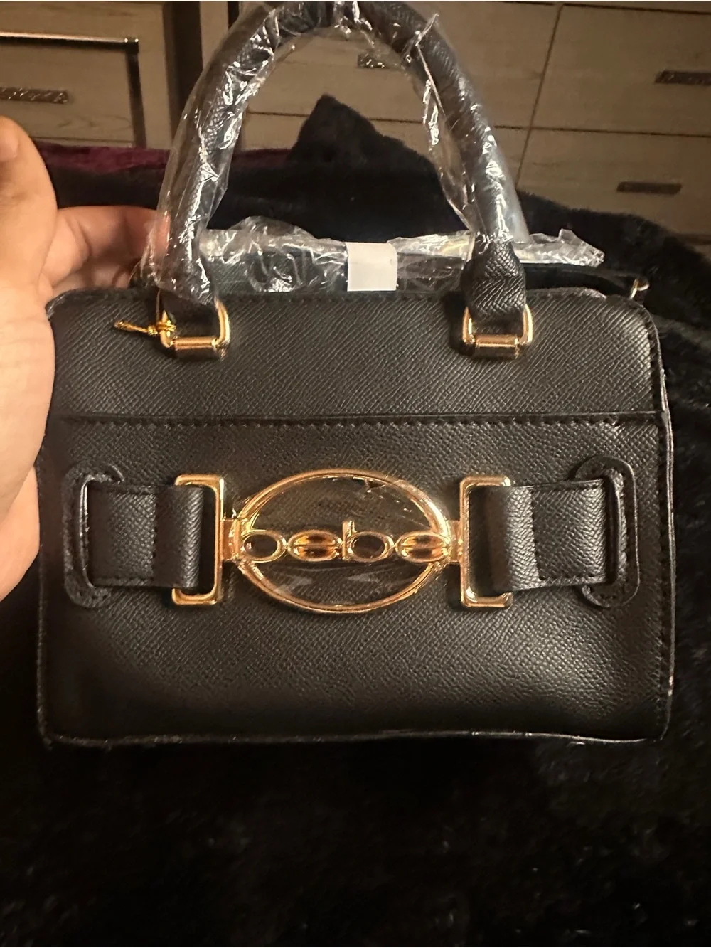 Black Handheld Women's Bag with Gold Accent